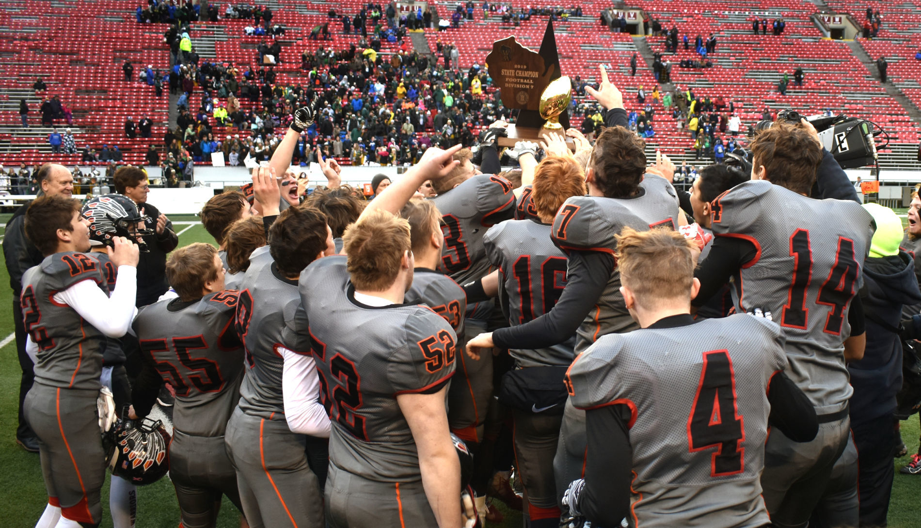 WIAA state football finals photo: Black Hawk players receive their championship trophy
